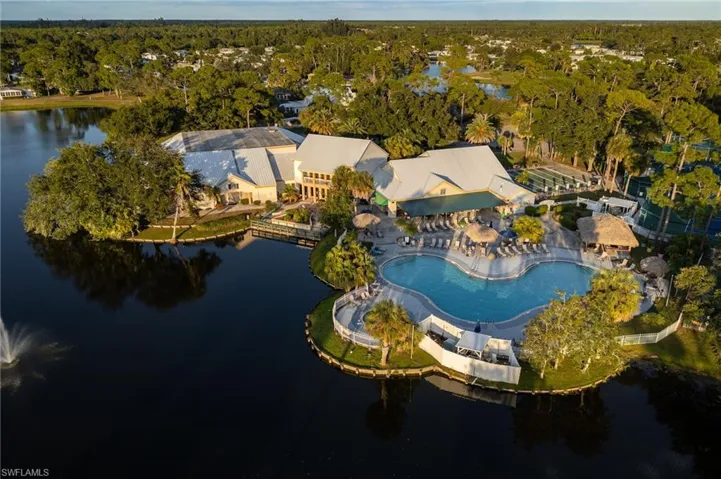View of property location with a large body of water and a pool area