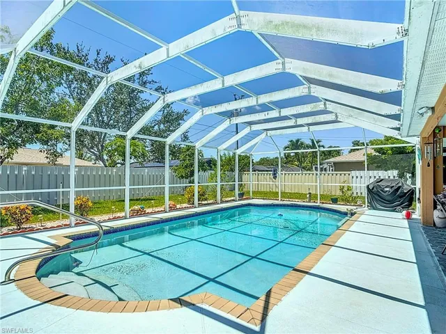 View of pool with screen enclosure
