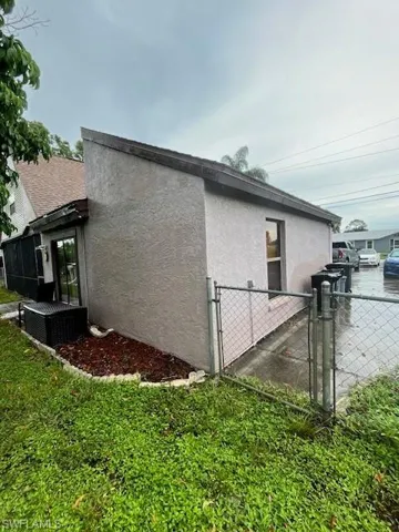 View of property exterior featuring central AC unit