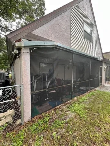 View of home's exterior with a sunroom