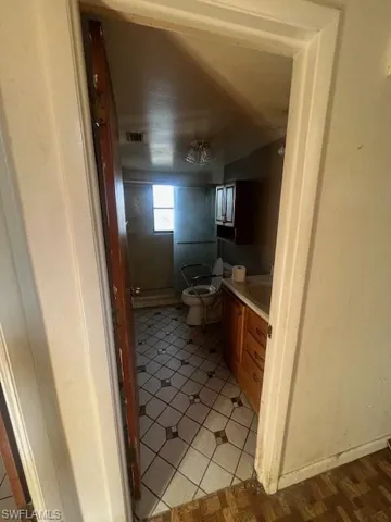 Bathroom featuring vanity and toilet