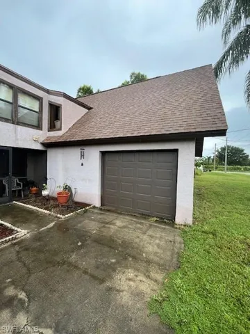 Garage featuring a yard