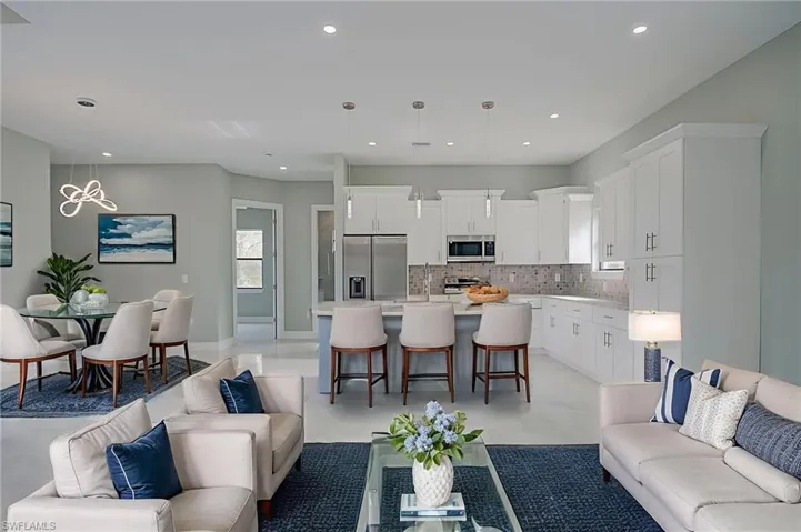 Living area featuring a chandelier and recessed lighting
