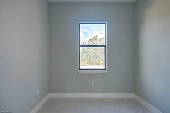 Empty room with baseboards