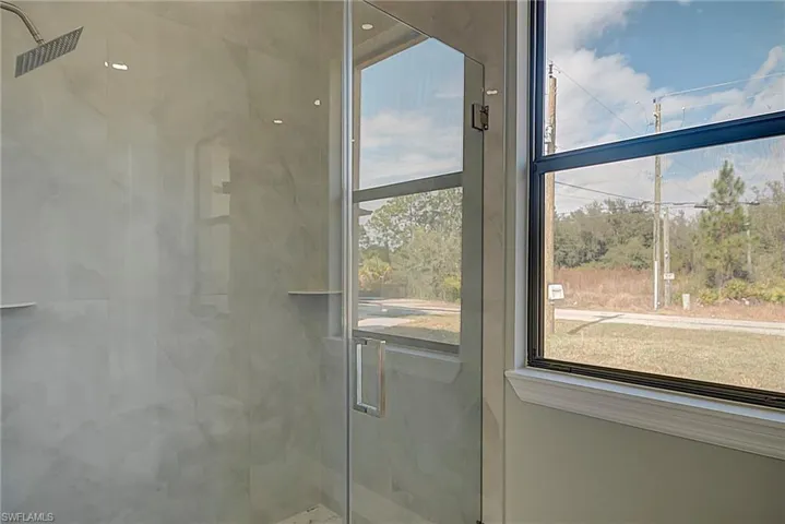 Bathroom view of a marble finish shower