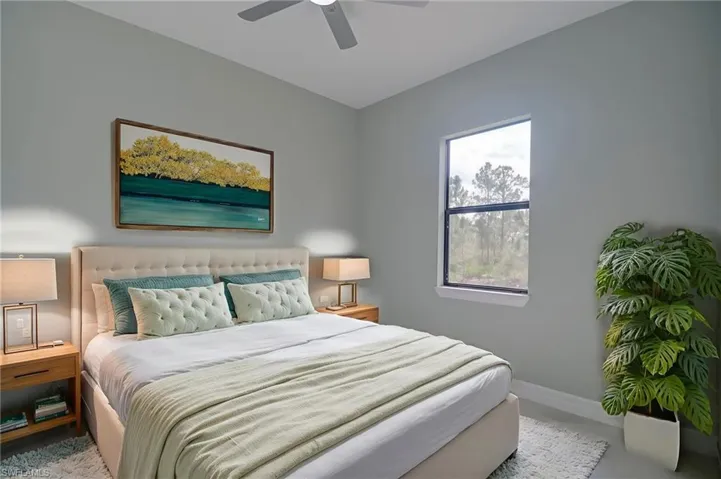 Bedroom featuring baseboards and ceiling fan