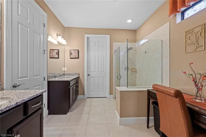 Master bathroom with large walk-in tile shower.
