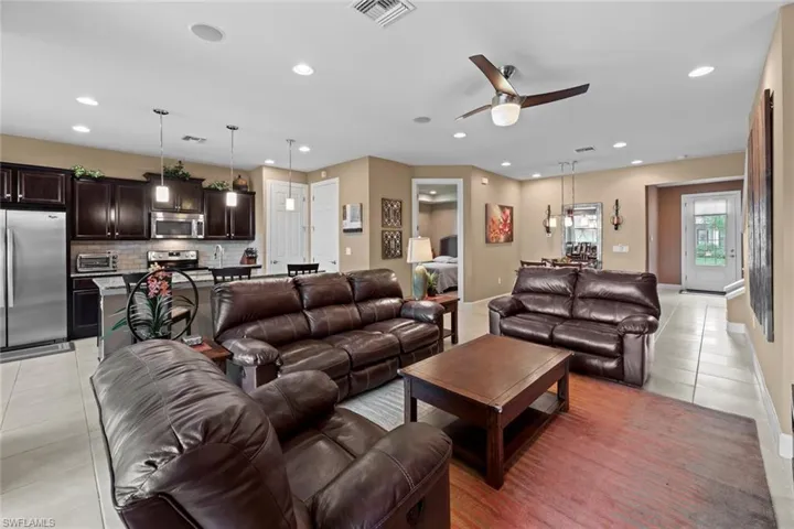 Living room with kitchen in the background.