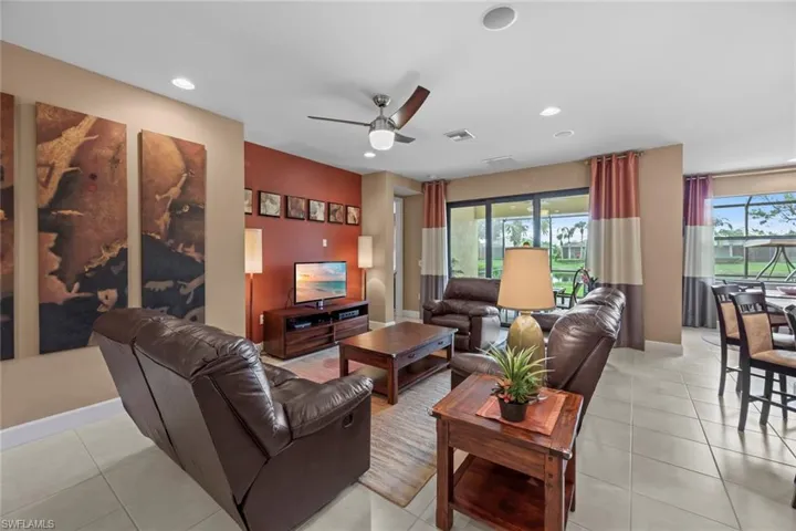 Living room with doorway to master bedroom to the left of the sliding glass doors.