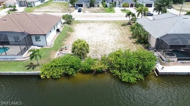 Cleared residential lot with mature vegetation at the waterfront