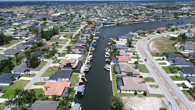Aerial perspective showcasing a residential waterway community with private boat docks