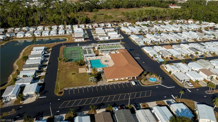 Aerial view of property's location with nearby suburban area and a large body of water