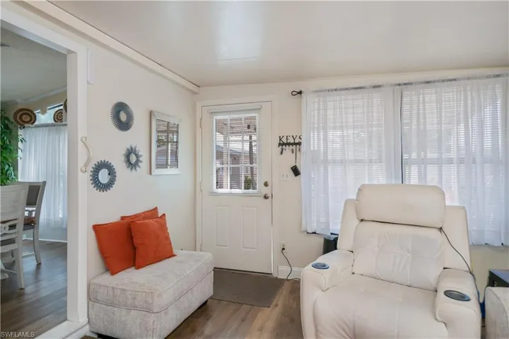Living area featuring wood finished floors and baseboards