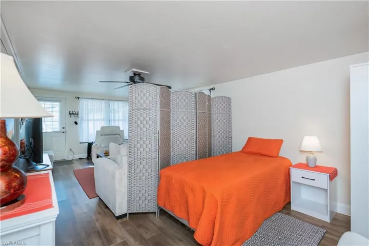 Bedroom with wood finished floors and ceiling fan