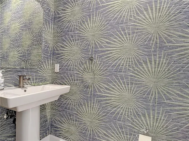 Bathroom featuring tile walls