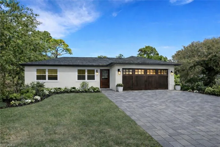 Photo includes reality renovation and/or staging to showcase the possibility of the front of the home. Design services included with purchase!