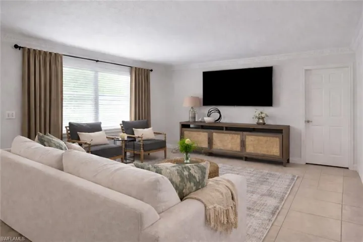 Photo includes reality renovation and/or staging to showcase the possibility of the Living Room. Design services included with purchase!