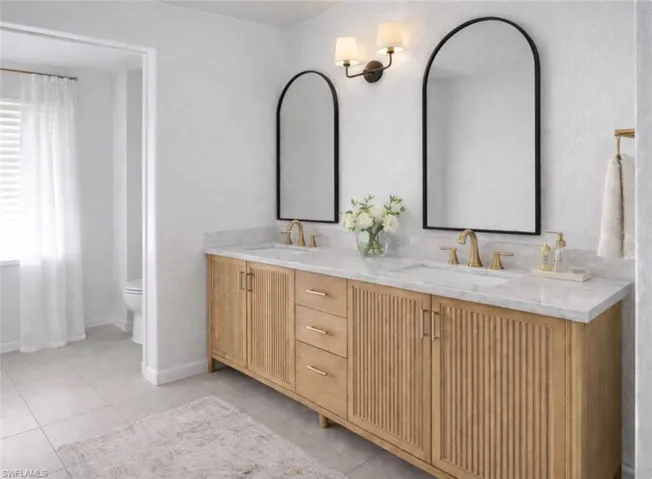 Photo includes reality renovation and/or staging to showcase the possibility of the Primary Bathroom. Design services included with purchase!