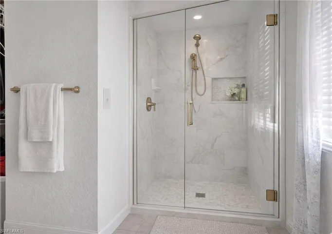Photo includes reality renovation and/or staging to showcase the possibility of the Primary Bath shower. Design services included with purchase!