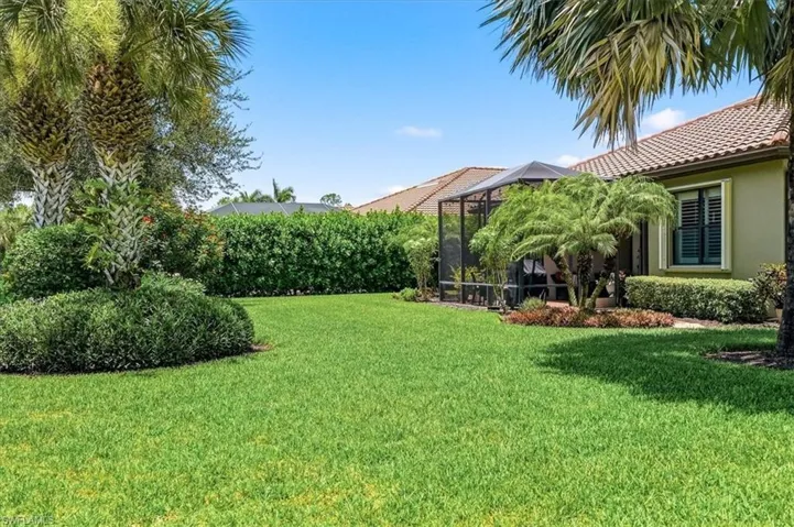 Expansive green lawn with mature landscaping