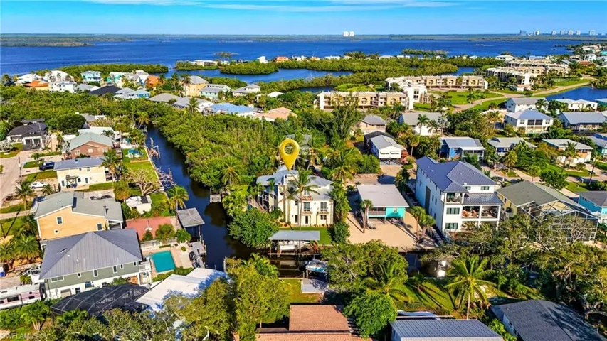 Aerial perspective of suburban area featuring a large body of water - Virtually Edited Image