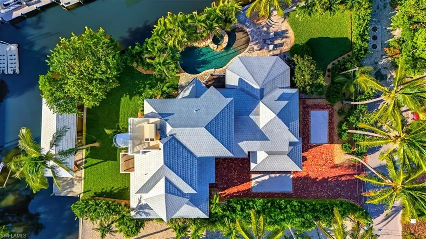 View of front of home with a garage and decorative driveway - Virtually Edited Image