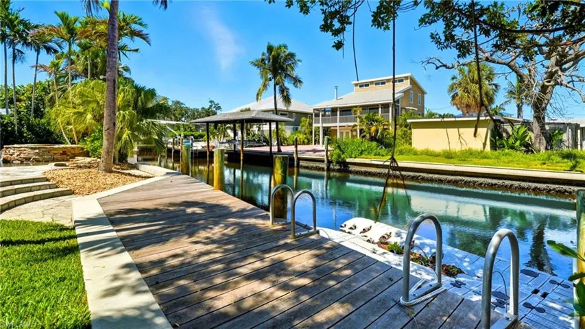 Dock featuring a water view - Virtually Edited Image