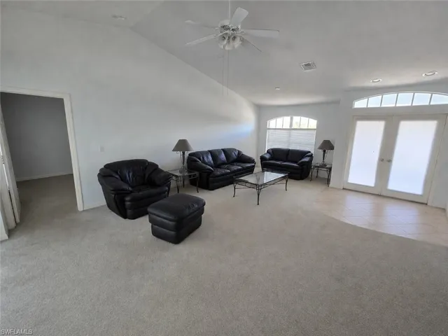 Living Room with AI Editing - Doors to Lanai and Pool!