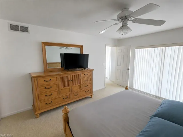 Primary Bedroom with AI Editing with Separate Sliders to Pool!