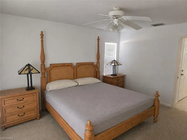Primary Bedroom with AI Editing with Separate Sliders to Pool!