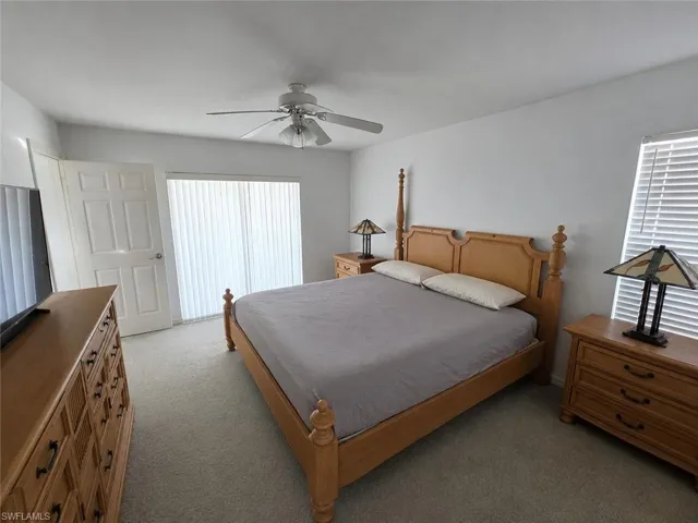 Primary Bedroom with AI Editing with Separate Sliders to Pool!