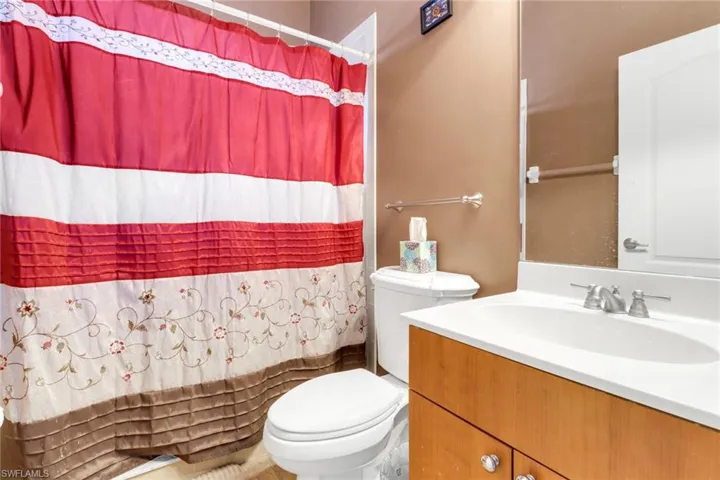 Bathroom with vanity and a shower with curtain