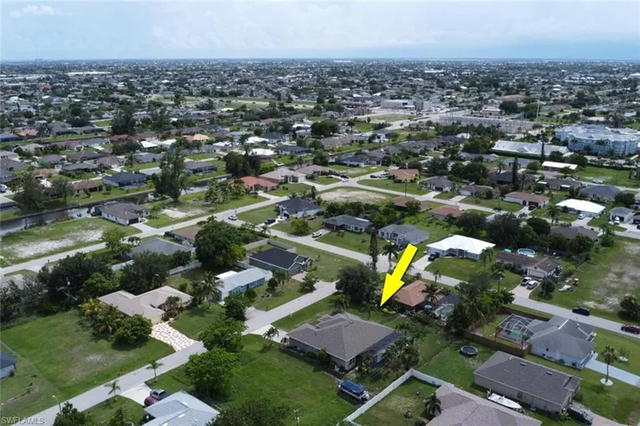 Aerial overview of property's location featuring nearby suburban area