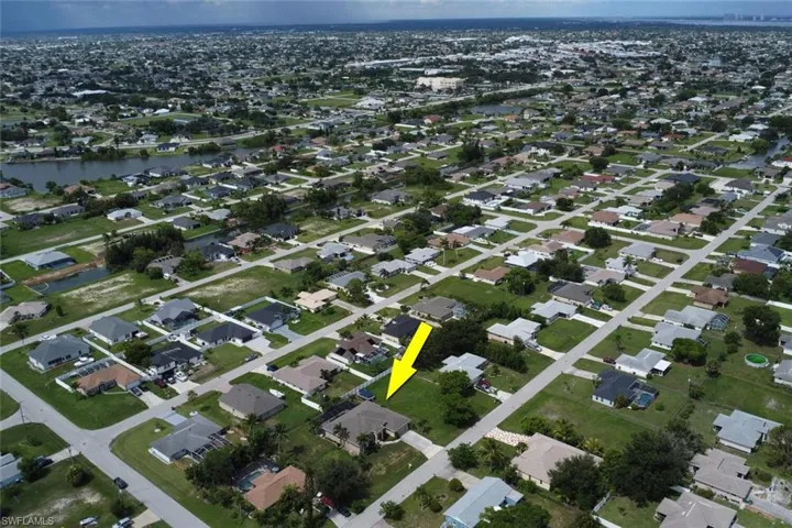 View of property location with nearby suburban area