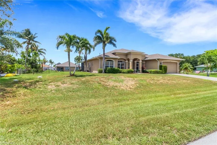 Mediterranean / spanish-style home featuring stucco siding, an attached garage, and concrete driveway