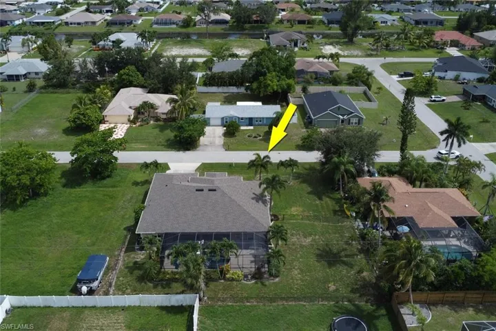 Aerial overview of property's location featuring nearby suburban area
