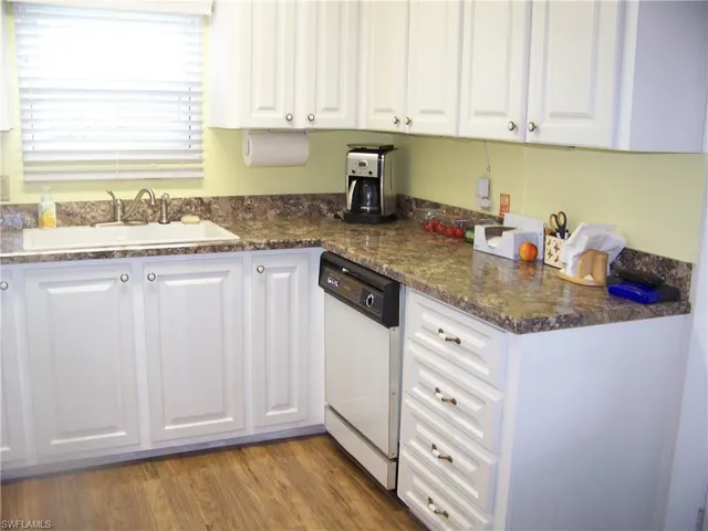 Newer raised cabinet doors with matching hardware.