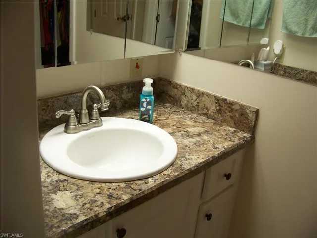 Single sink located separately in ensuite bathroom