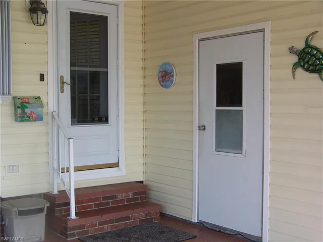 Front door entry to kitchen