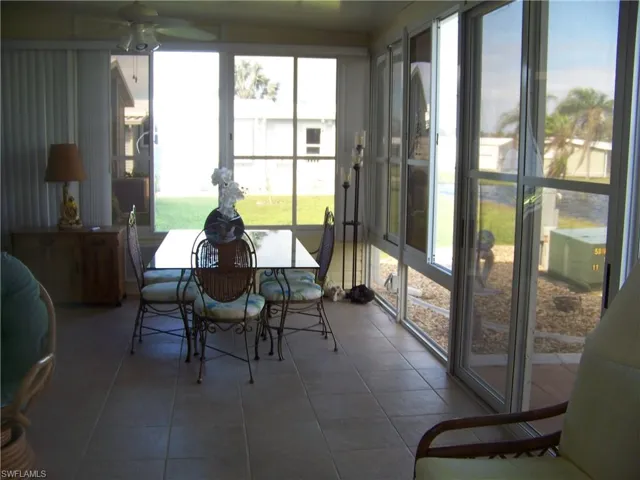 Another side of HUGE lanai in rear overlooking pond!