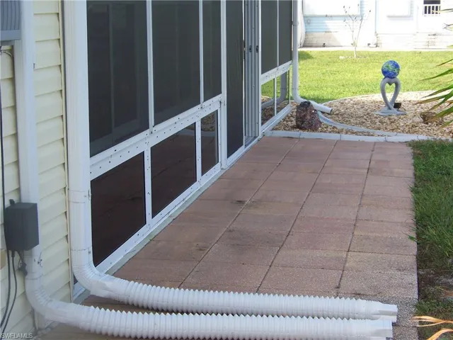 Tiled patio in rear outside HUGE lanai. Sit out here breeze and take it all in!!!