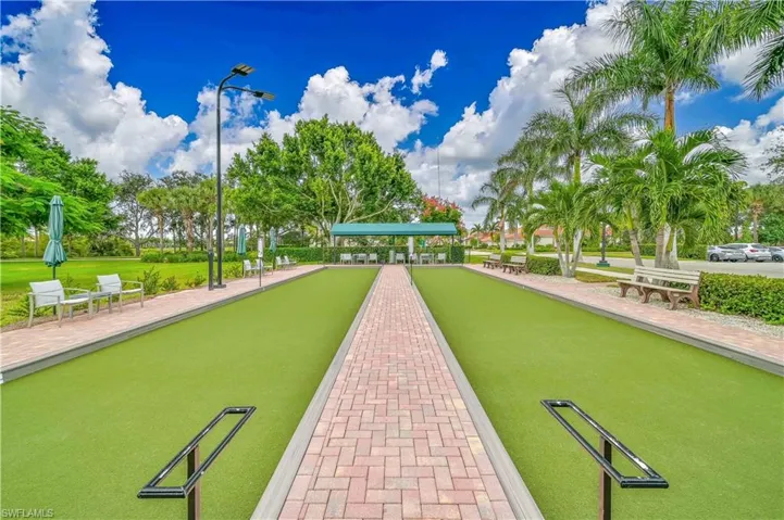 View of property's community with a bocce ball area
