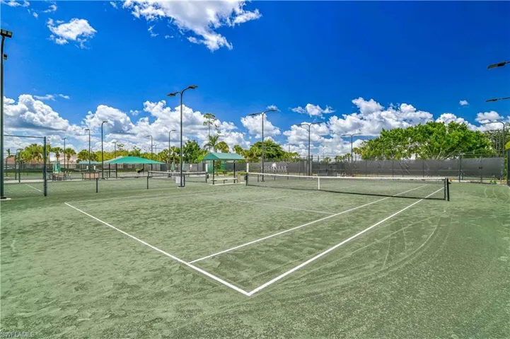 View of tennis court featuring community basketball court