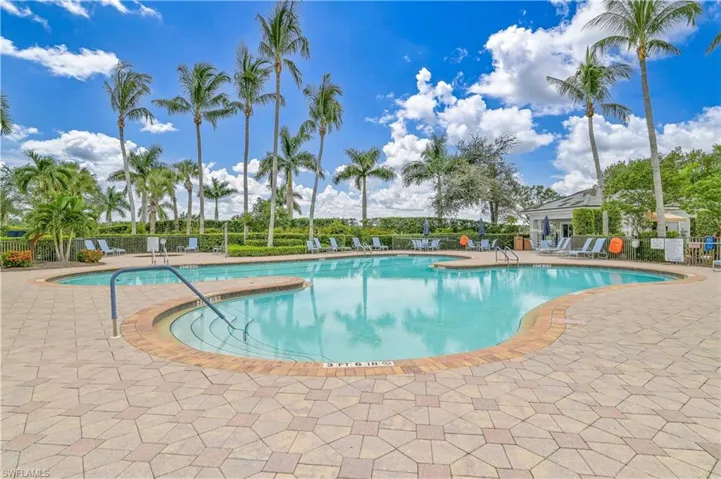 Community pool with a patio area