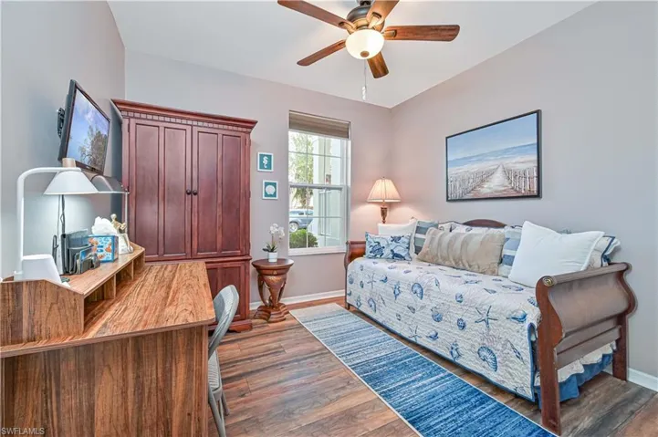 Living area featuring light wood finished floors and ceiling fan