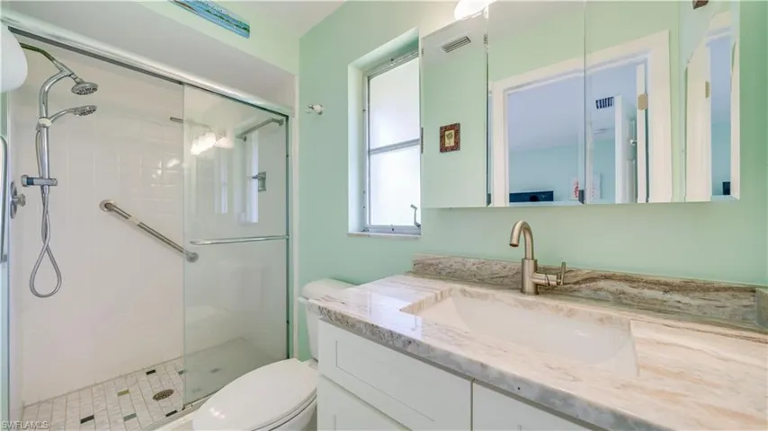 Upgraded en-suite with tiled walk-in shower and granite countertop.