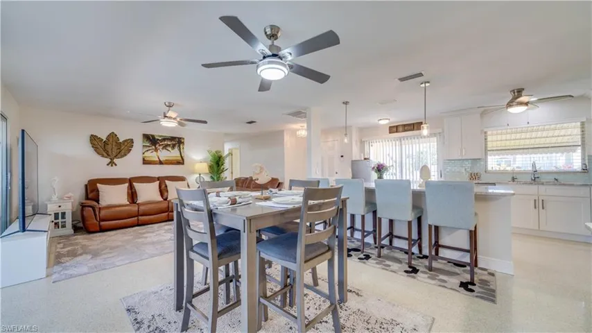 Welcome in! Open concept living, dining & kitchen. Also open to sunroom to the right.