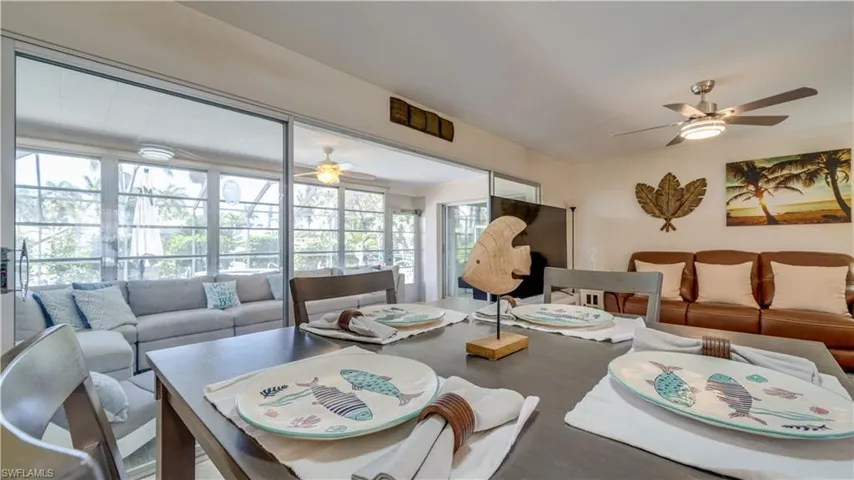 View of the sunroom provides additional room for sitting & entertaining.