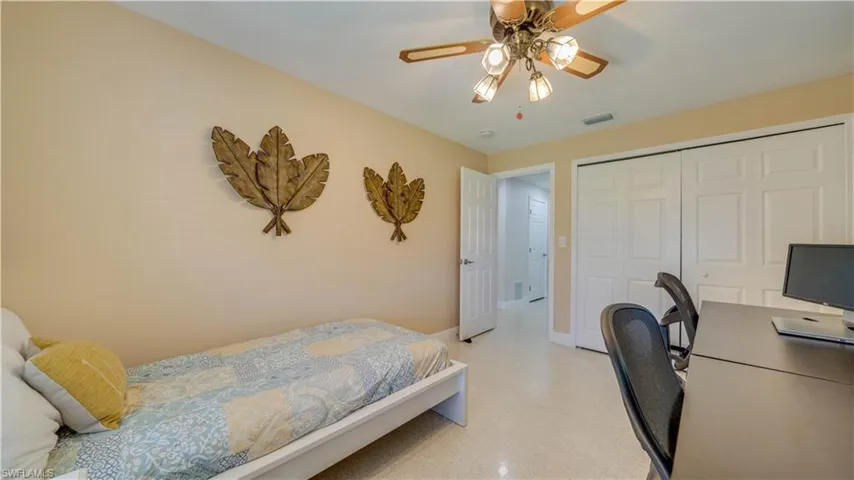 First guest bedroom features large closets.