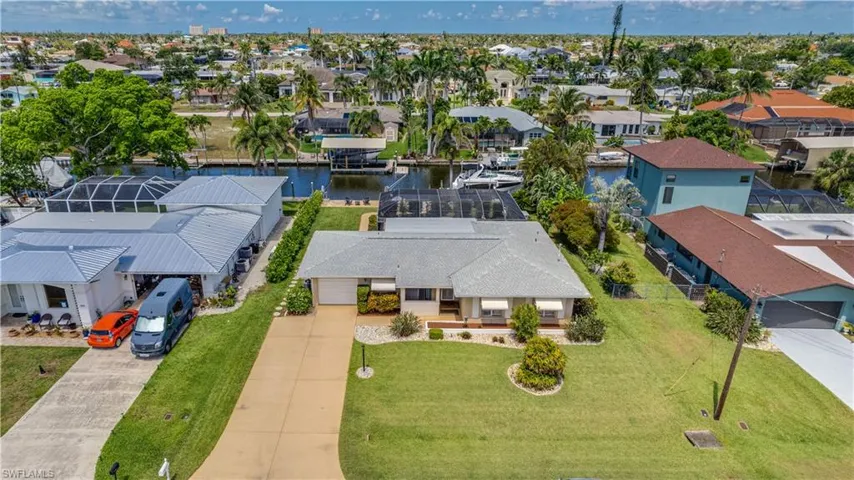Aerial view of the front of the property showing canal in back.